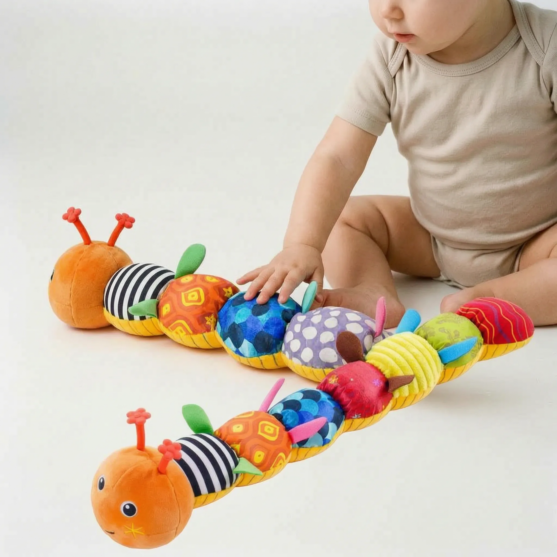 Babyrammelaar - Muzikale Sensorische Wormknuffel